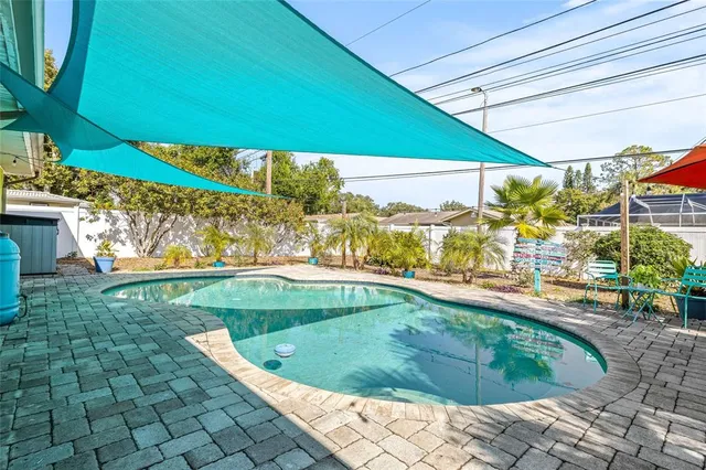 a view of a dining room with furniture water view and pool table