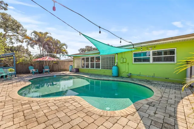 a living room with furniture and flat screen tv