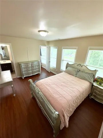 a bedroom with a bed and dresser