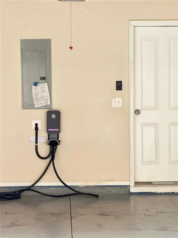 a view of a livingroom with painted walls and a door