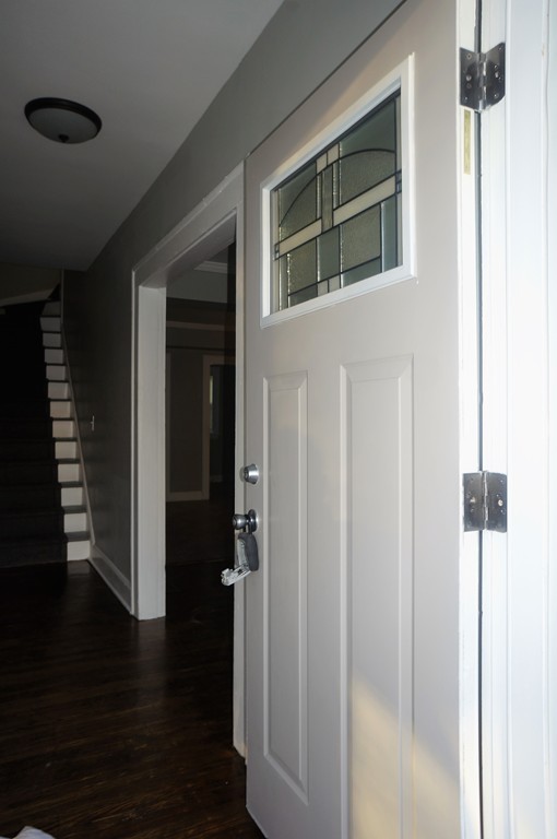 38 Fenwick Street Springfield, MA 01109 - Photo 5 of 28 a view of a hallway with wooden floor and staircase