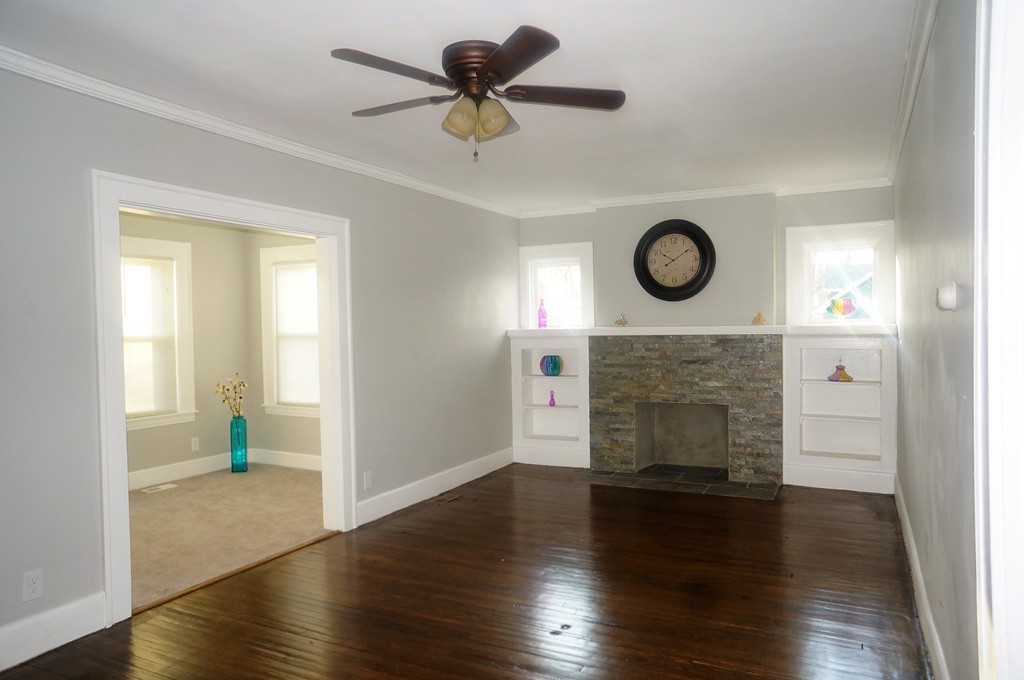 38 Fenwick Street Springfield, MA 01109 - Photo 7 of 28 a view of an empty room with a fireplace and a window