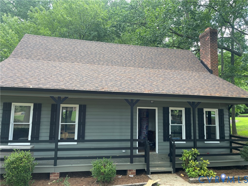 1291 Grapevine Road Sandston, VA 23150 - Photo 1 of 1 Front exterior featuring gray siding, a covered po