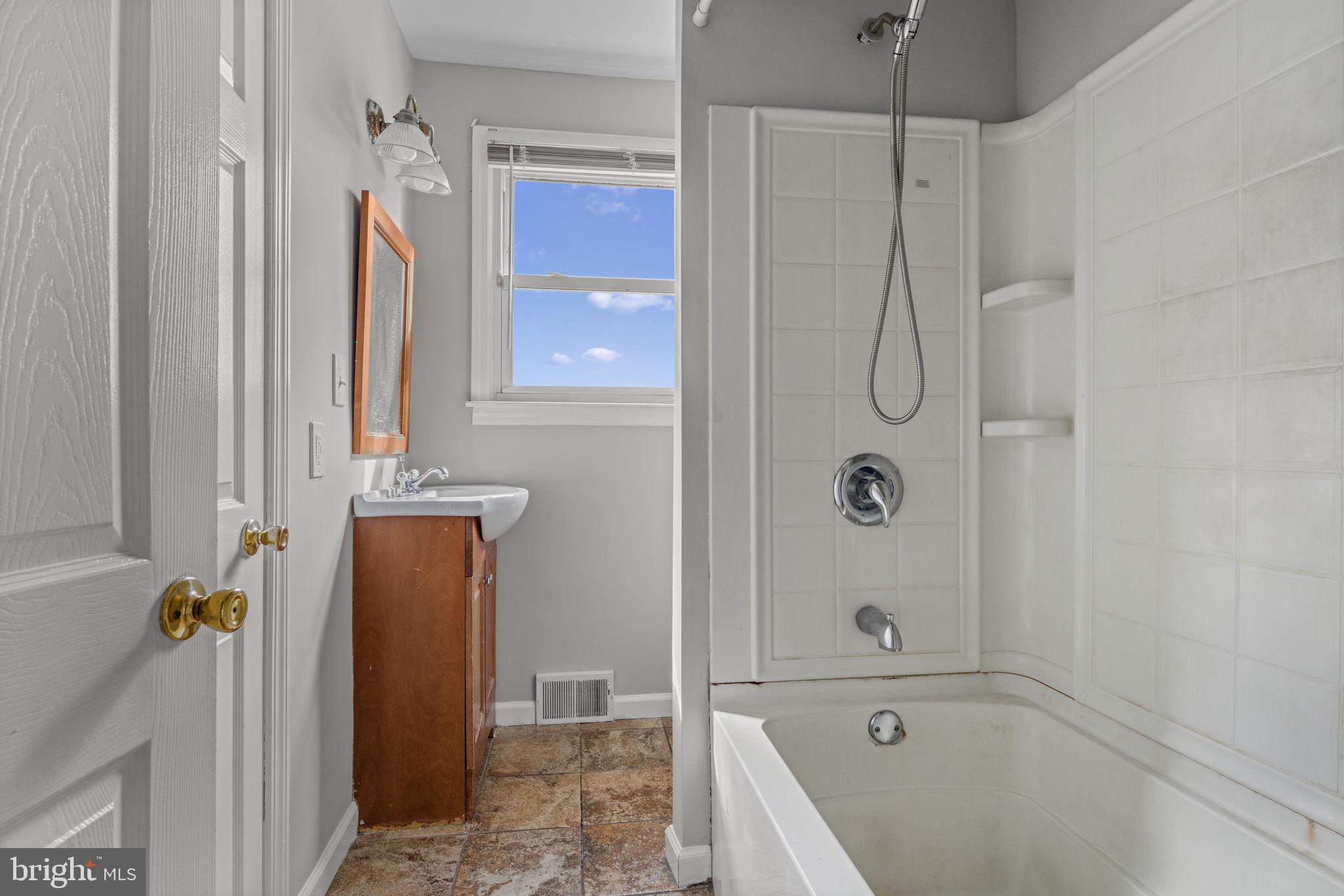3 Cloverdale Road Blackwood, NJ 08012 - Photo 11 of 28 a bathroom with a tub shower and a sink
