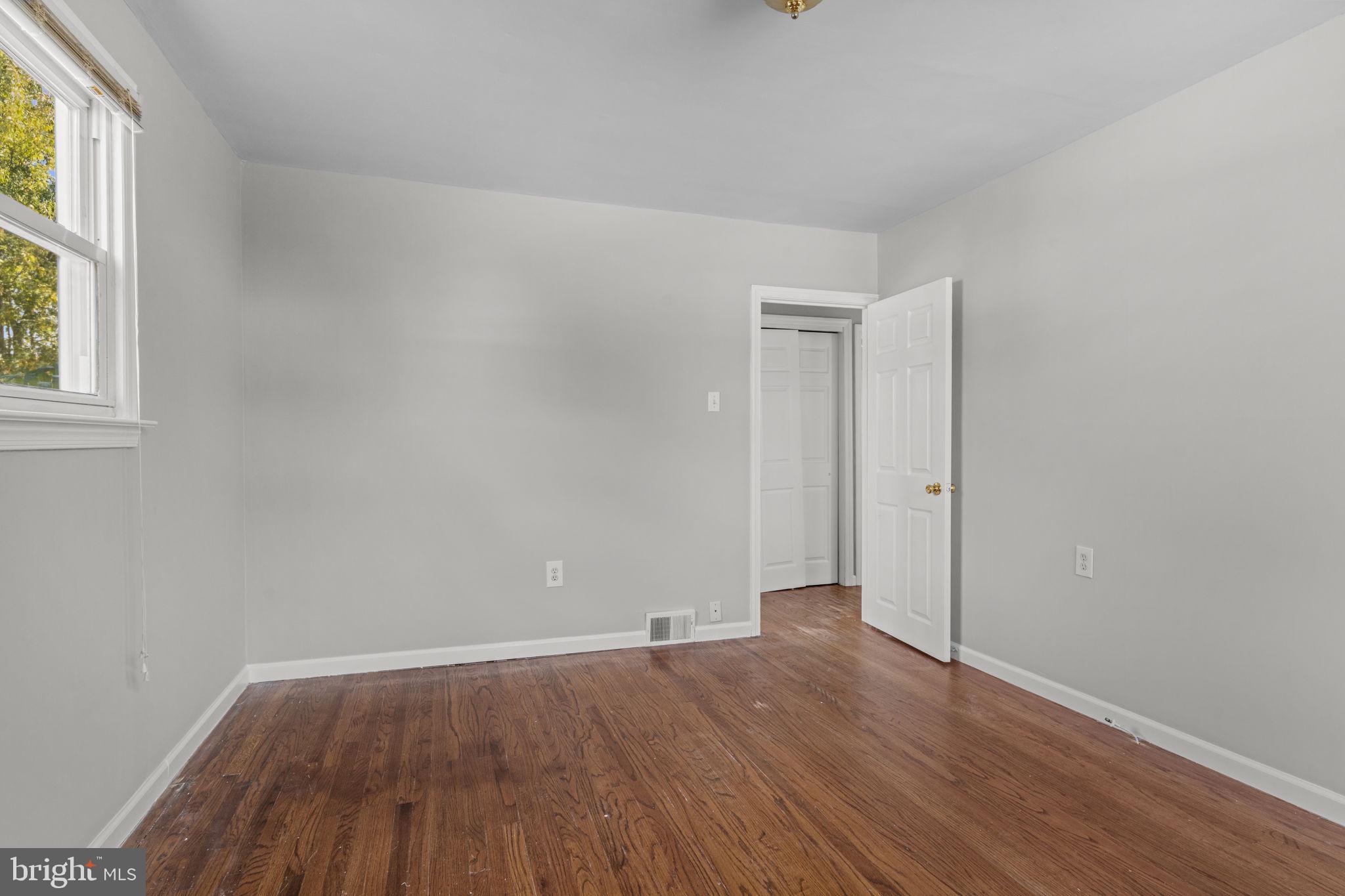 3 Cloverdale Road Blackwood, NJ 08012 - Photo 13 of 28 an empty room with wooden floor and windows