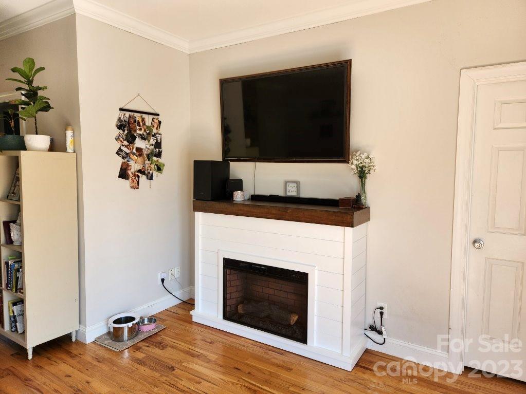 2326 Center Road Chester, SC 29706 - Photo 16 of 42 a living room with a fireplace and a flat screen tv