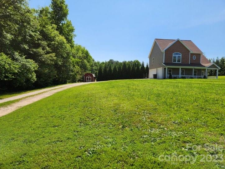2326 Center Road Chester, SC 29706 - Photo 2 of 42 a view of a big house with a big yard and large trees