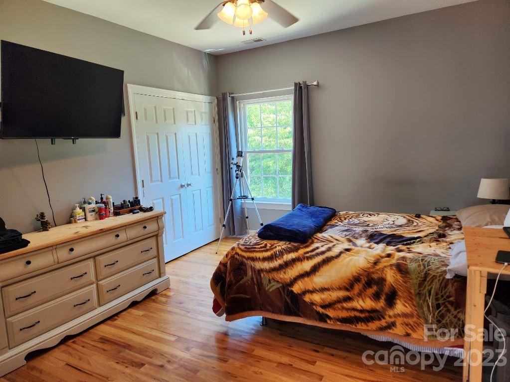 2326 Center Road Chester, SC 29706 - Photo 25 of 42 a bedroom with a bed and a flat tv screen on dresser