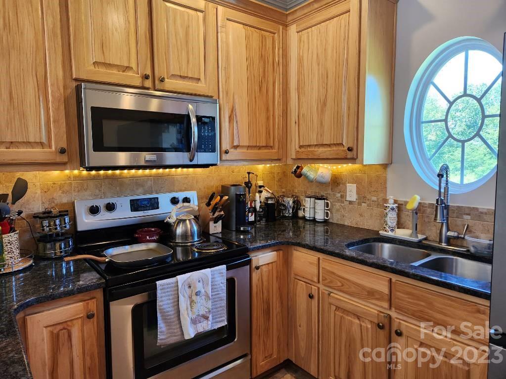 2326 Center Road Chester, SC 29706 - Photo 28 of 42 a kitchen with stainless steel appliances a stove a sink and a microwave