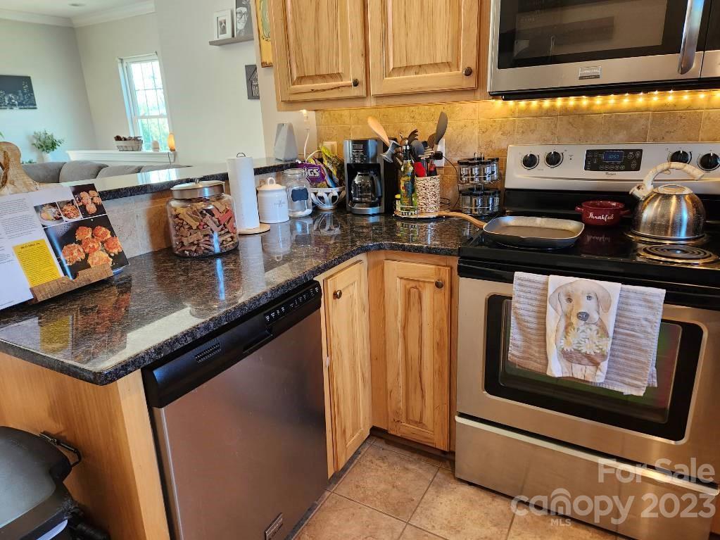 2326 Center Road Chester, SC 29706 - Photo 29 of 42 a kitchen with stainless steel appliances granite countertop a stove and cabinets
