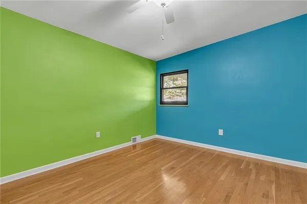 a view of room with window and ceiling fan