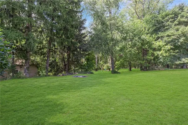 a view of house with yard