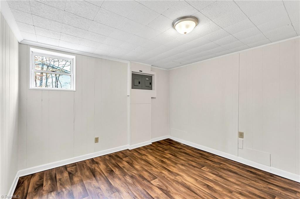 795 Dan Valley Road Madison, NC 27025 - Photo 31 of 38 Basement Office: Features include new vinyl plank flooring for easy cleaning, a window for natural lighting, fresh paint and a storage closet.