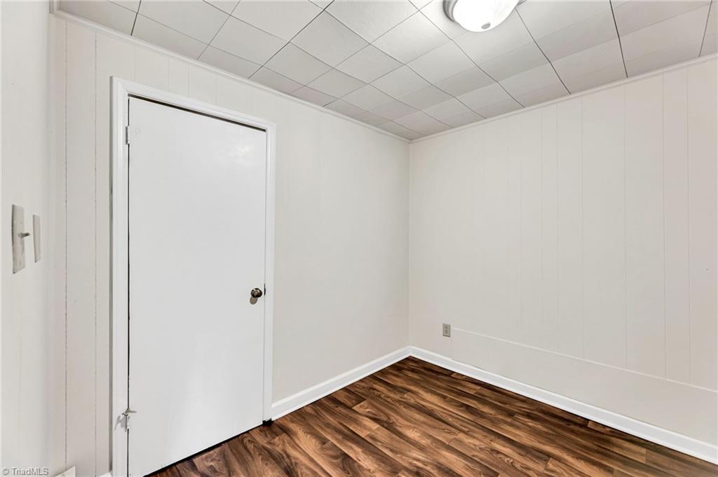 795 Dan Valley Road Madison, NC 27025 - Photo 33 of 38 Basement Playroom: Features include new vinyl plank flooring for easy cleaning, a closet and fresh paint.