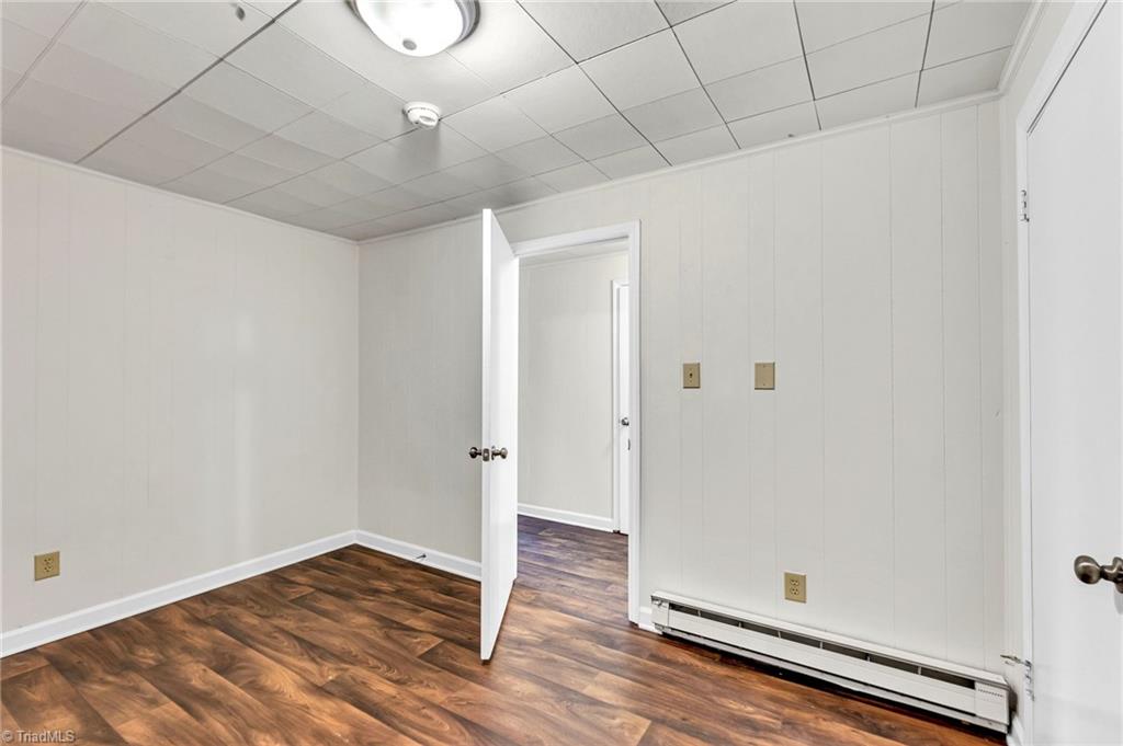 795 Dan Valley Road Madison, NC 27025 - Photo 34 of 38 Basement Playroom: Features include new vinyl plank flooring for easy cleaning, a closet and fresh paint.