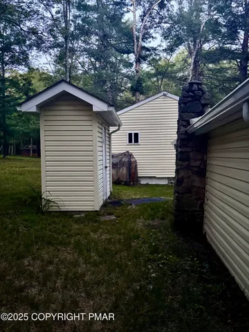 a backyard of a house with lots of green space