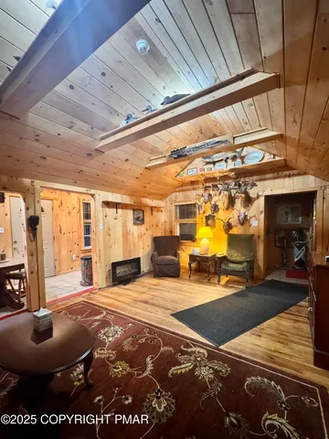 a spacious bedroom with a bed and a large window