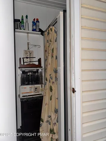 a room with a bench and a window