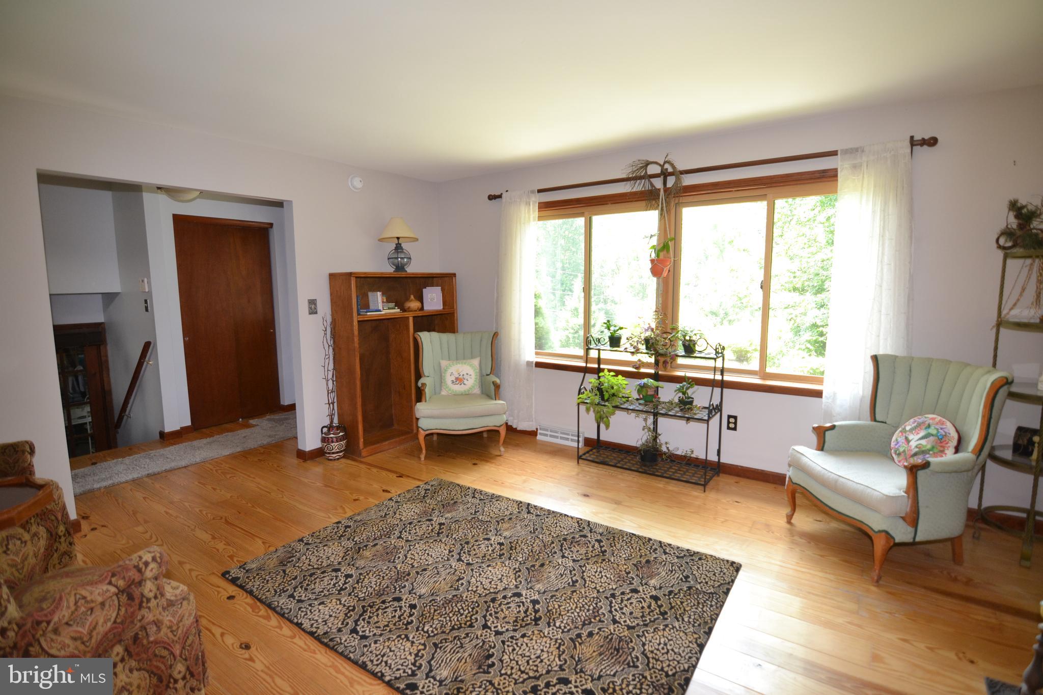 329 Isabella Road Elverson, PA 19520 - Photo 22 of 73 Formal Living room with wide plank hardwood floors