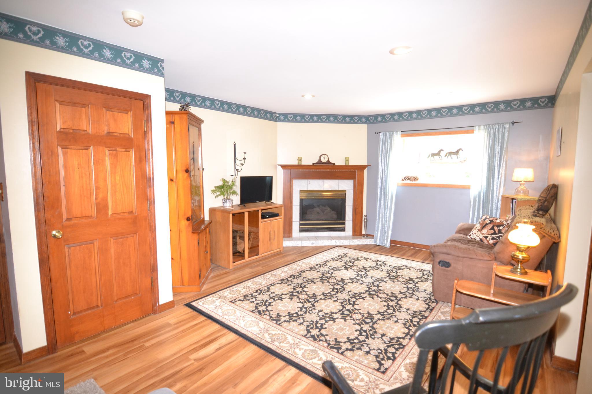 329 Isabella Road Elverson, PA 19520 - Photo 35 of 73 Family room with luxury vinyl plank flooring