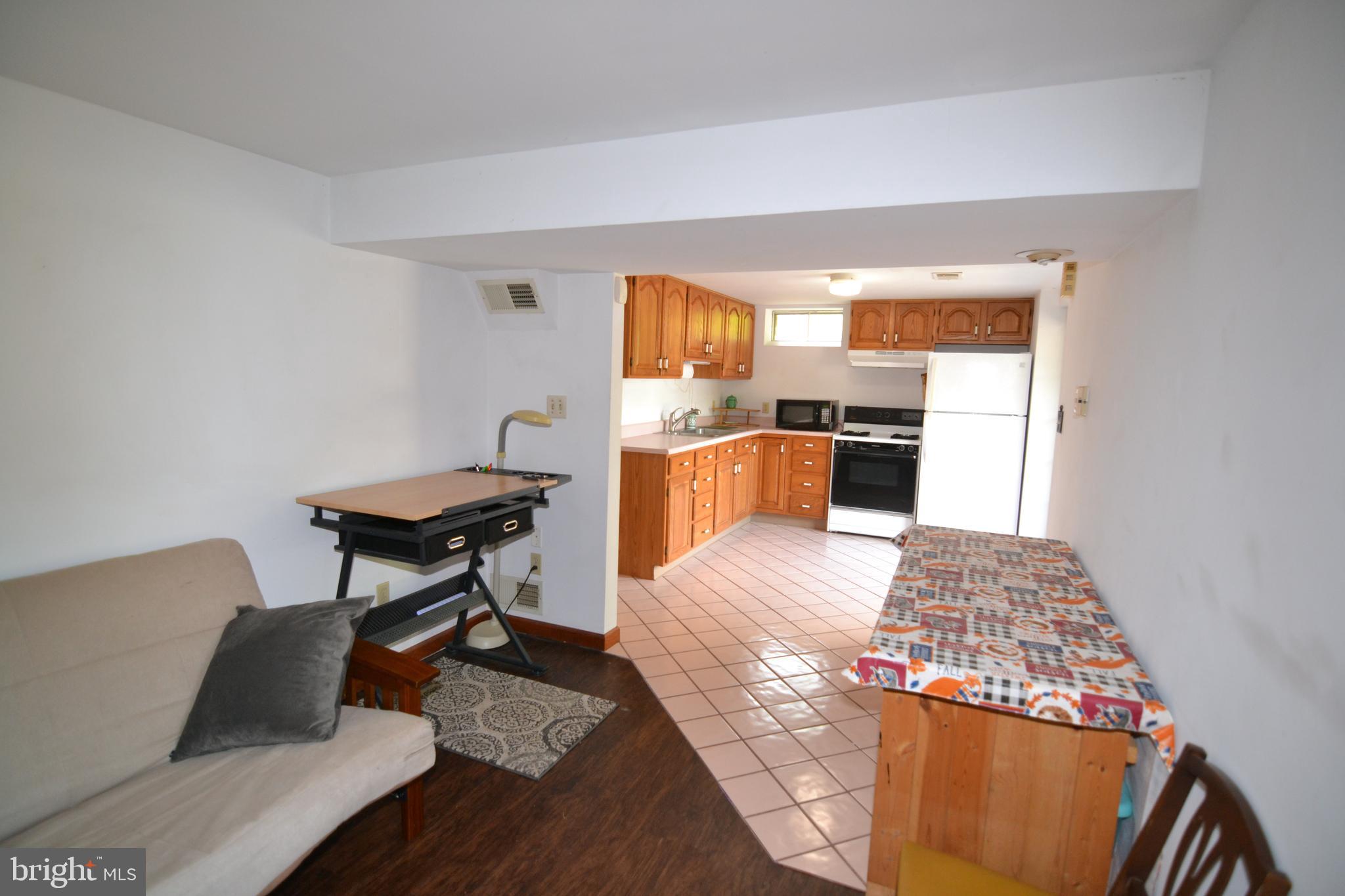 329 Isabella Road Elverson, PA 19520 - Photo 41 of 73 In-Law suite living room and kitchen