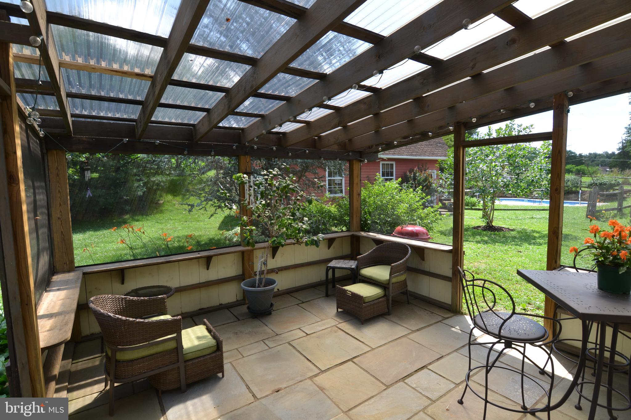 329 Isabella Road Elverson, PA 19520 - Photo 47 of 73 Screened in patio off of kitchen on main level