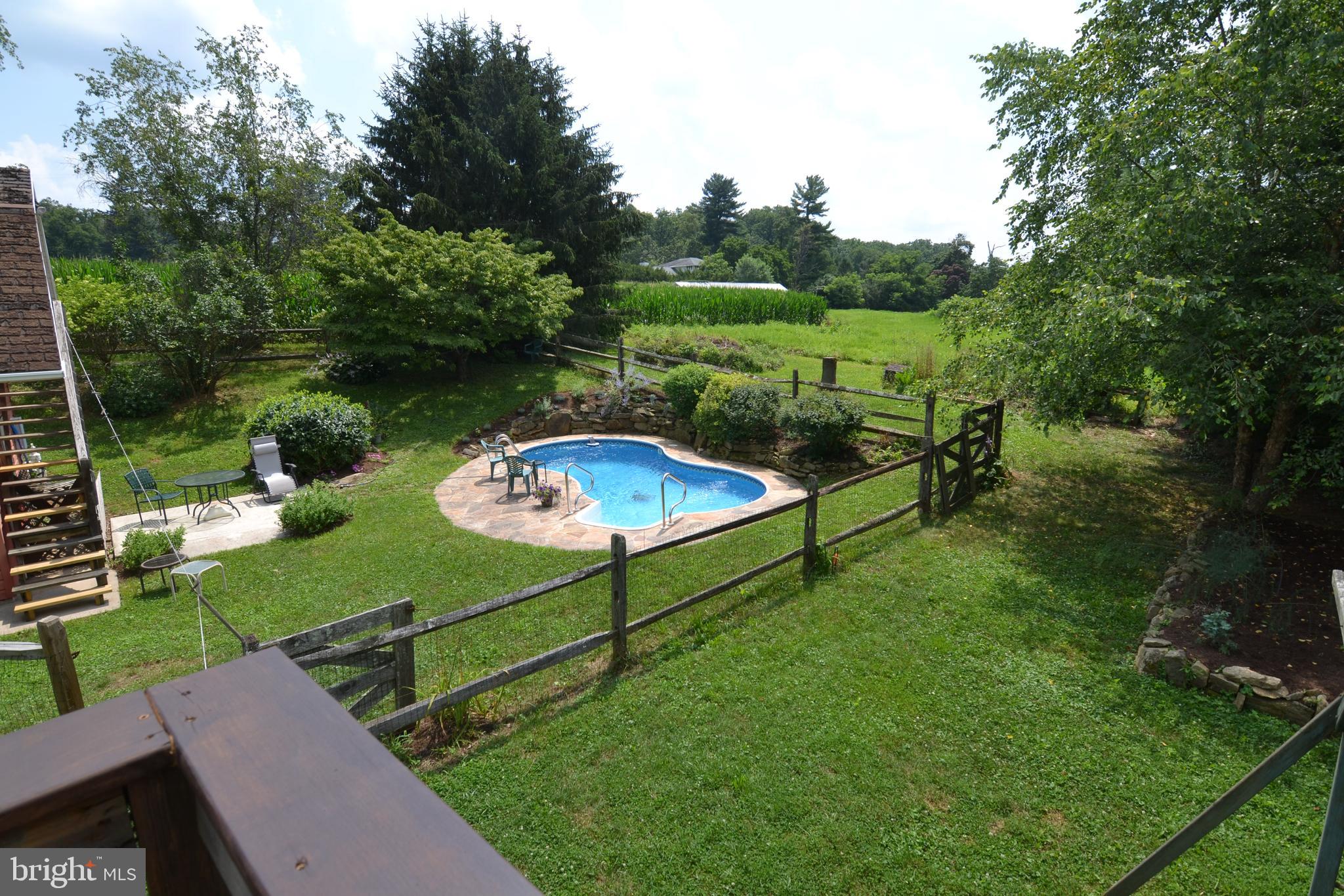 329 Isabella Road Elverson, PA 19520 - Photo 57 of 73 View from master bedroom deck to pool