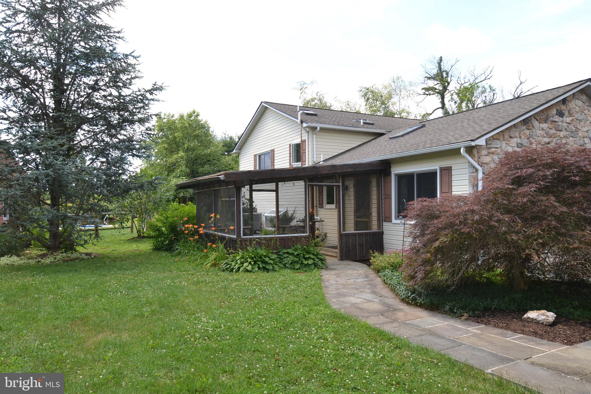 329 Isabella Road Elverson, PA 19520 - Photo 61 of 73 Rear of home with screened in patio