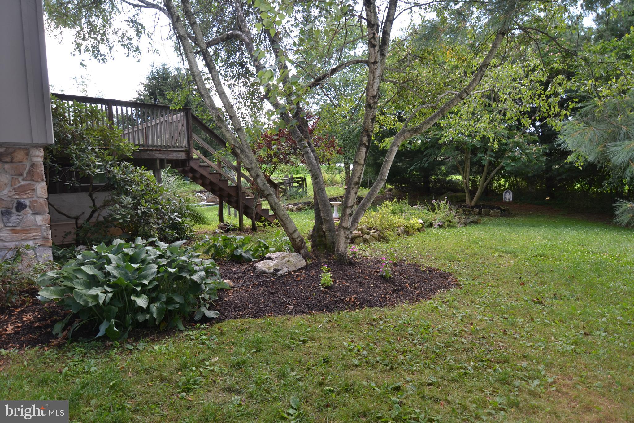 329 Isabella Road Elverson, PA 19520 - Photo 67 of 73 Side of home with deck and herb gardens