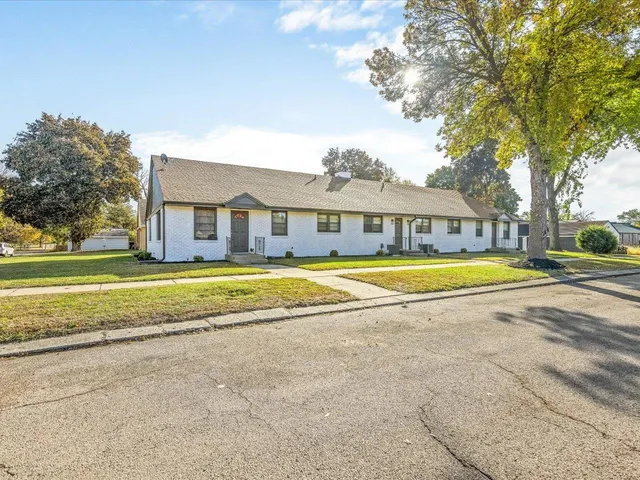 a view of a swimming pool in front of house