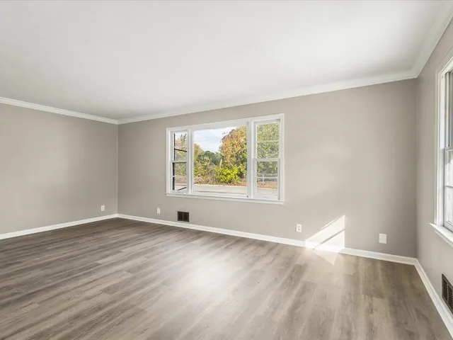 a kitchen with a sink cabinets and stainless steel appliances