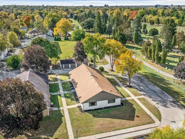 an aerial view of residential houses with outdoor space