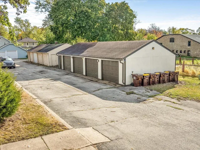 an aerial view of residential houses with yard