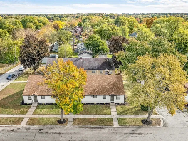 an aerial view of residential houses with outdoor space