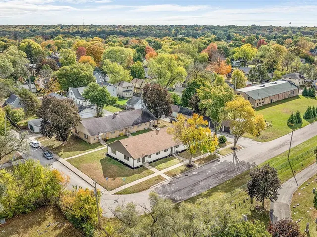 a view of a swimming pool with a yard