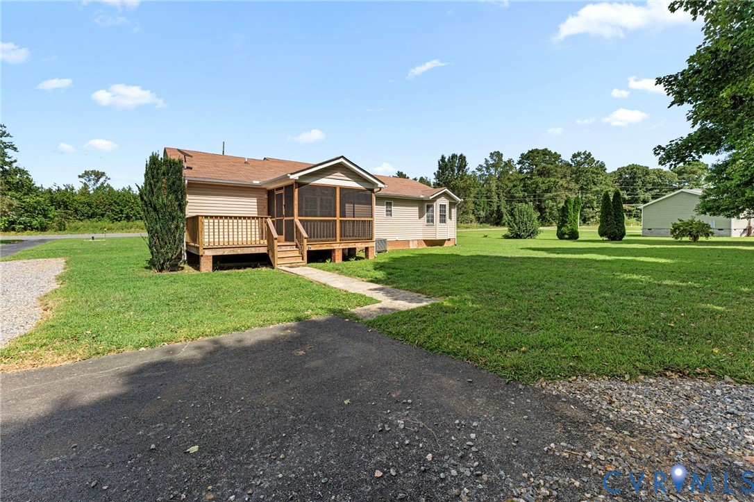 1146 Indian Valley Road Heathsville, VA 22473 - Photo 42 of 45 a view of a house with a big yard and large trees