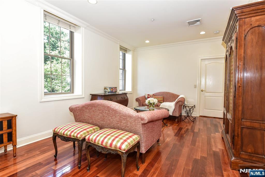 4201 Rio Vista Drive, Unit 4201 Mahwah, NJ 07430 - Photo 9 of 34 a living room with furniture and wooden floor