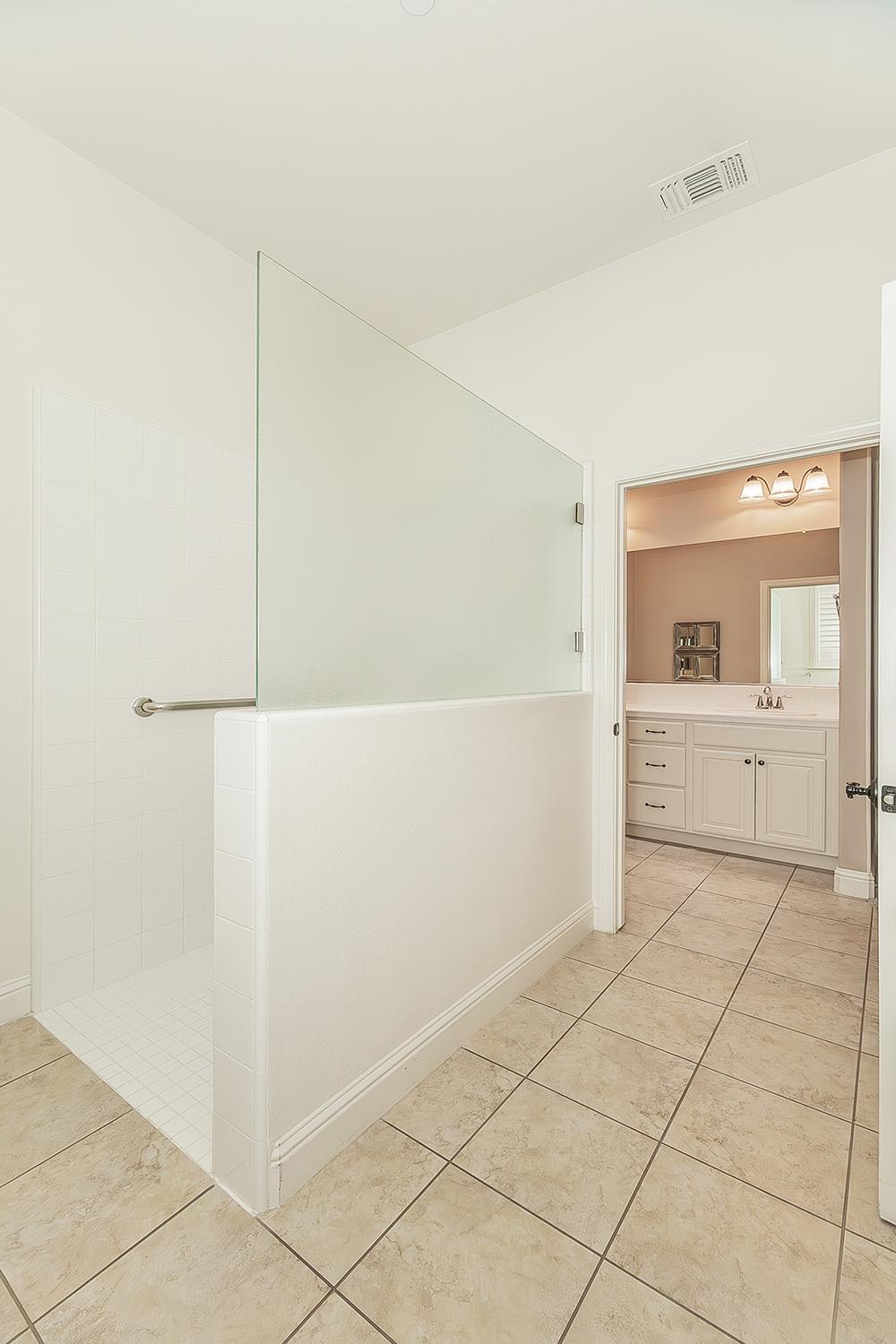 2047 South Church Avenue Reedley, CA 93654 - Photo 17 of 39 a view of a kitchen with white cabinets