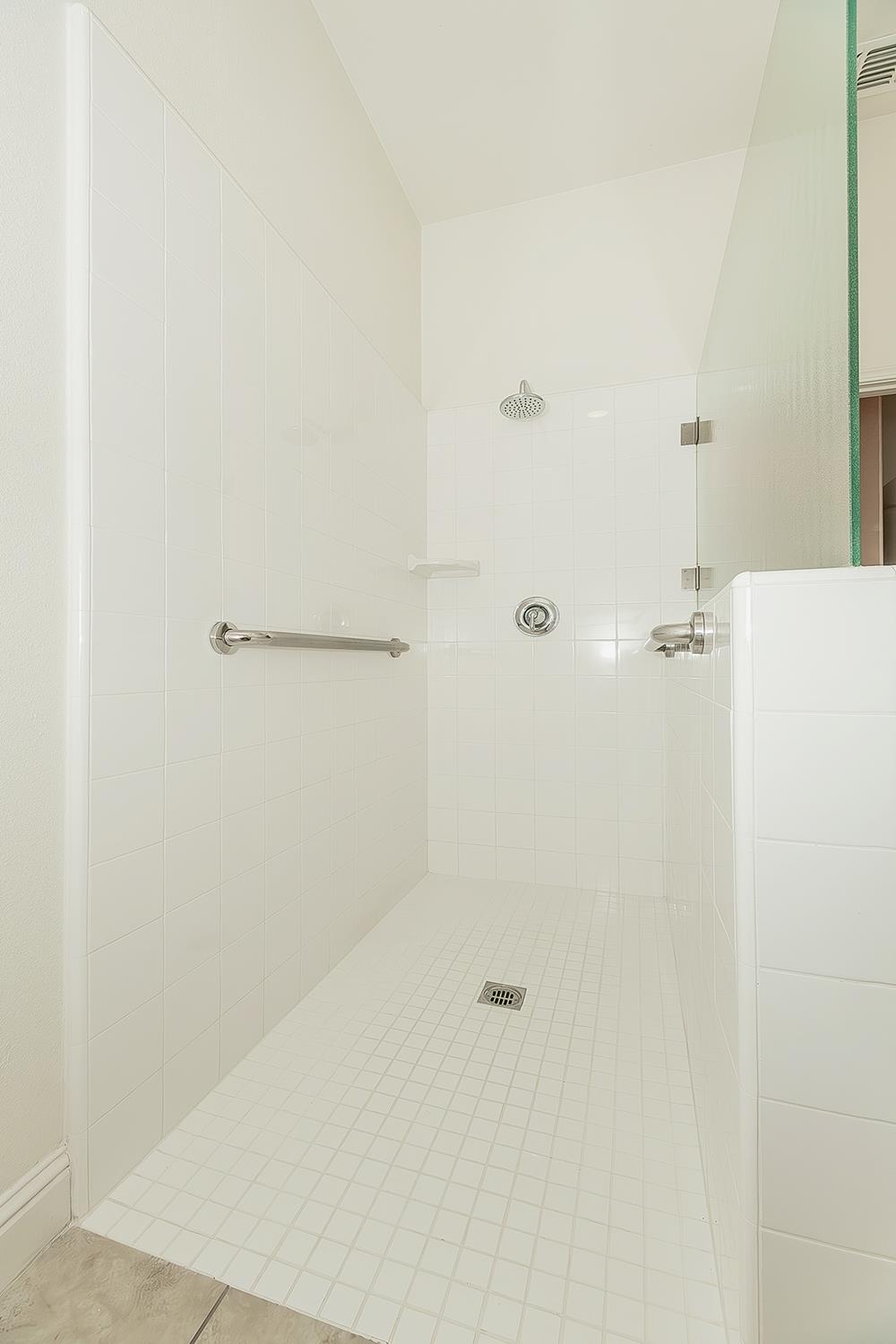 2047 South Church Avenue Reedley, CA 93654 - Photo 19 of 39 a bathroom with a shower