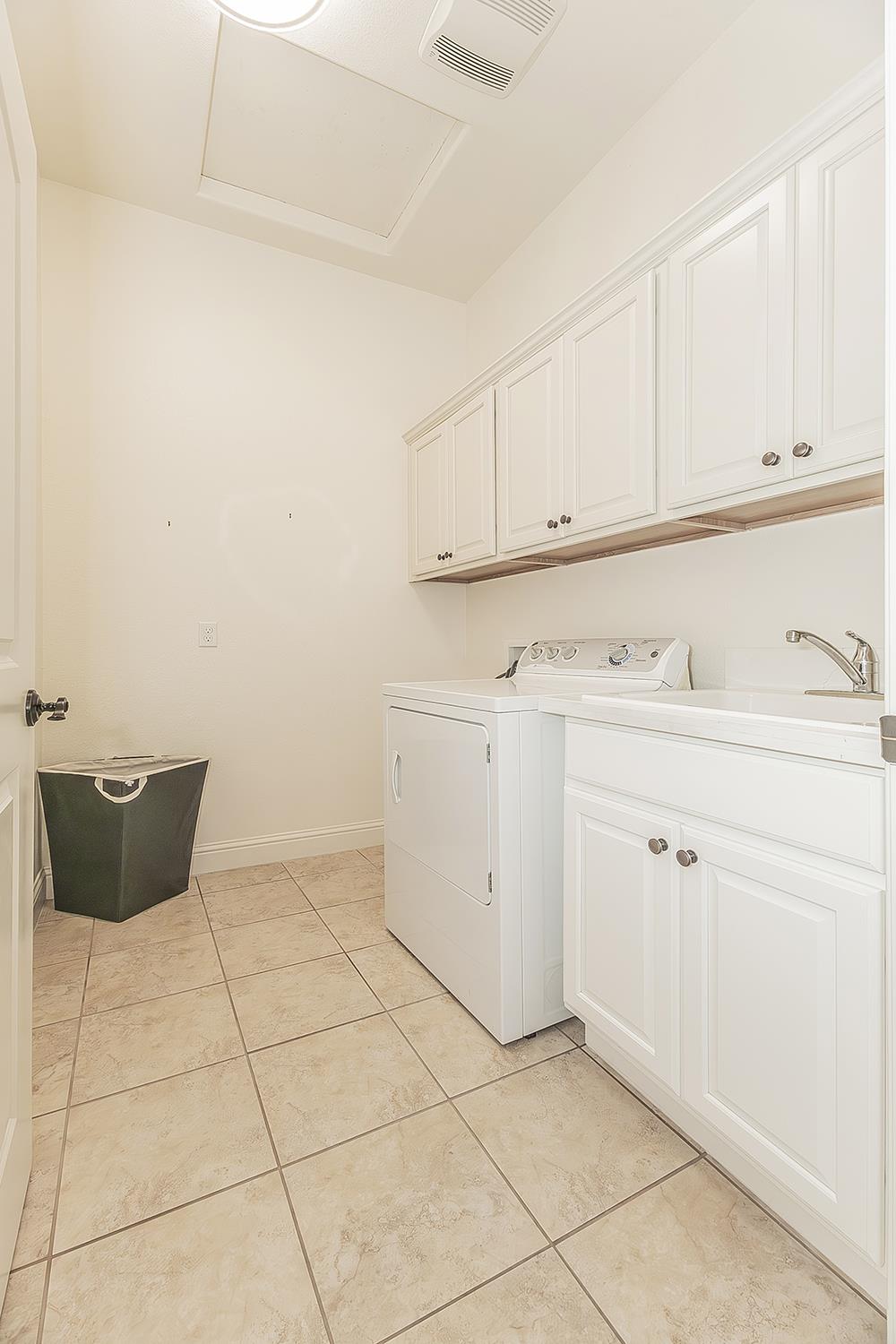 2047 South Church Avenue Reedley, CA 93654 - Photo 22 of 39 a view of a kitchen with white cabinets