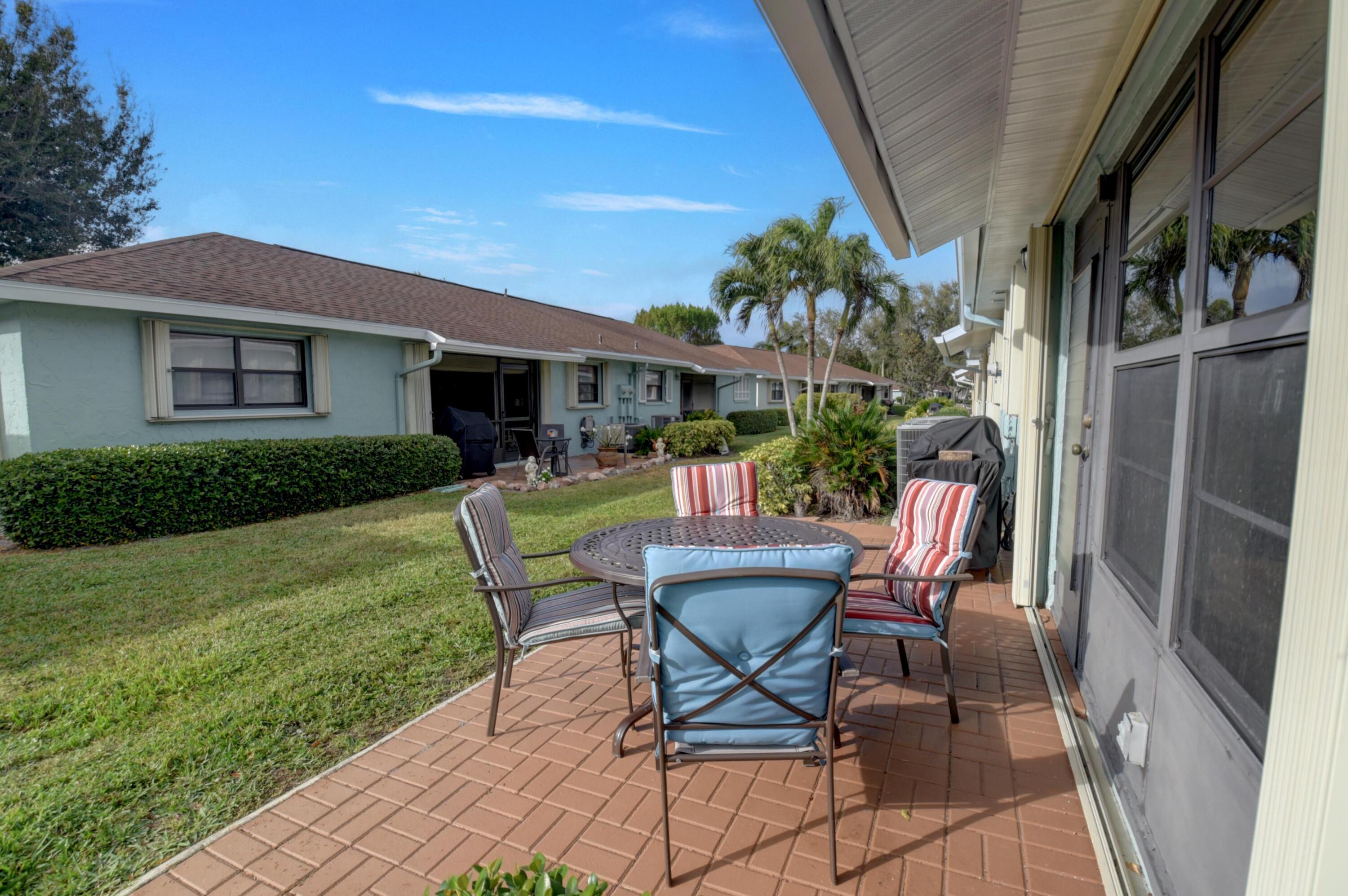 9855 Loquat Tree Run, Unit A Boynton Beach, FL 33436 - Photo 34 of 52 Back Exterior