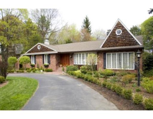 250 Ridgeway Road Weston, MA 02493 - Photo 1 of 20 a front view of a house with a yard and shrubs