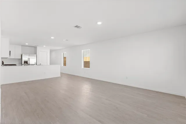 a view of a kitchen with a sink and a window