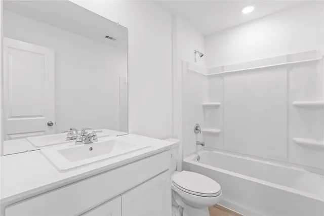 a bathroom with a sink a toilet and a bathtub