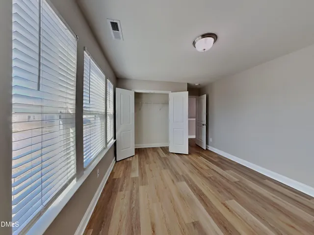 a view of wooden floor in an empty room