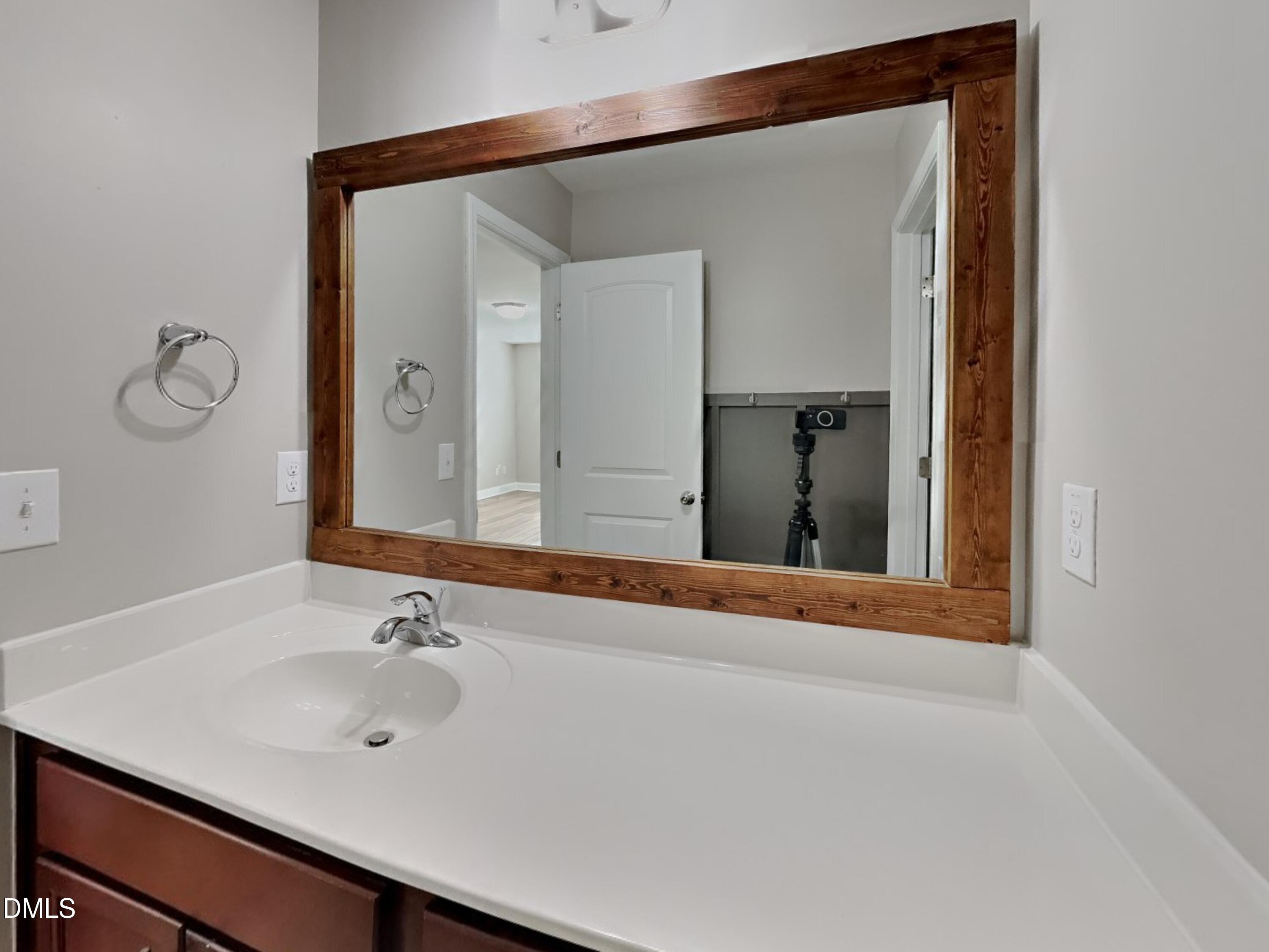 50 Gallery Park Drive Franklinton, NC 27525 - Photo 15 of 18 a bathroom with a sink and two mirror