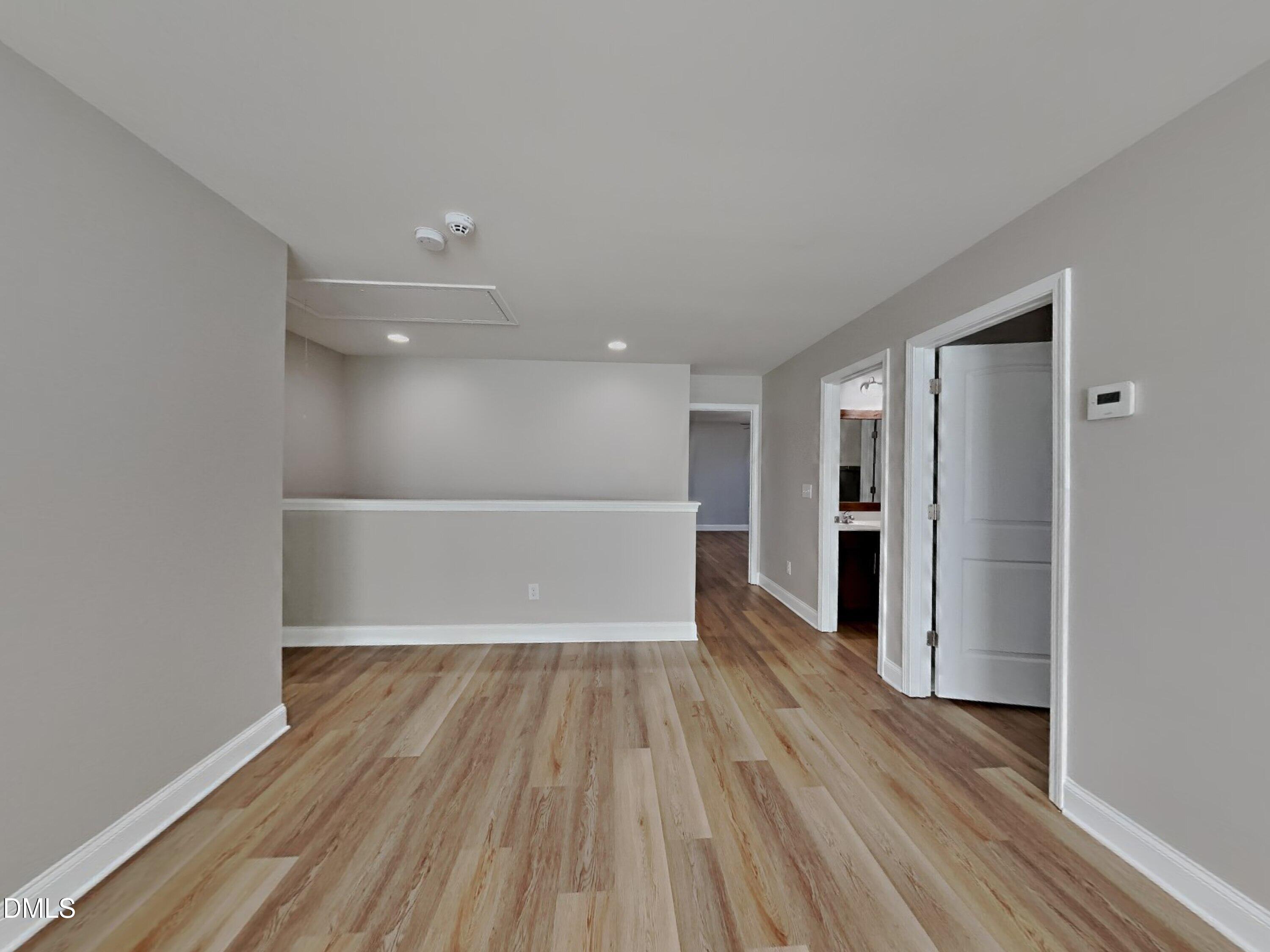 50 Gallery Park Drive Franklinton, NC 27525 - Photo 17 of 18 a view of a room with wooden floor and windows