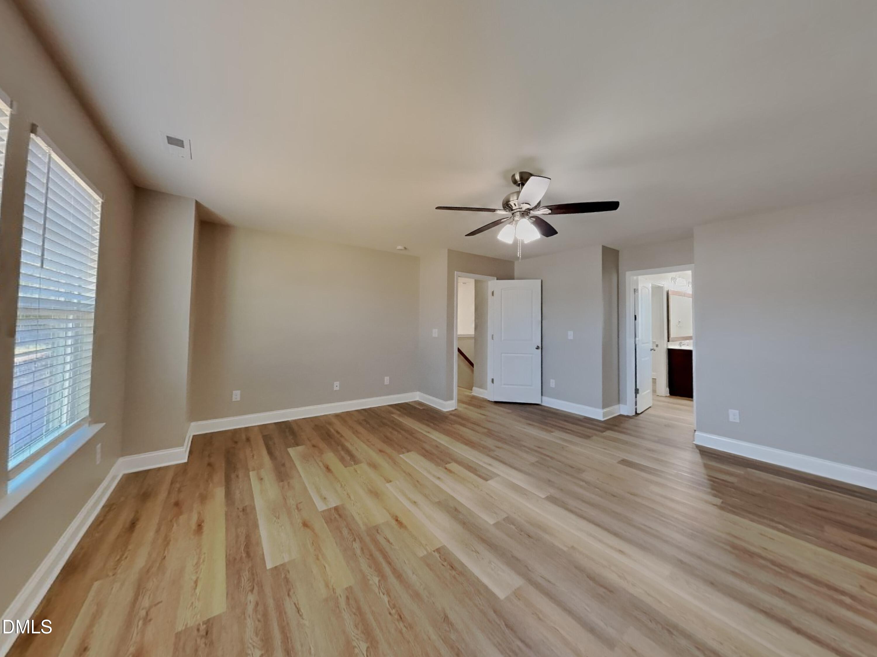 50 Gallery Park Drive Franklinton, NC 27525 - Photo 6 of 18 wooden floor in an empty room with a window