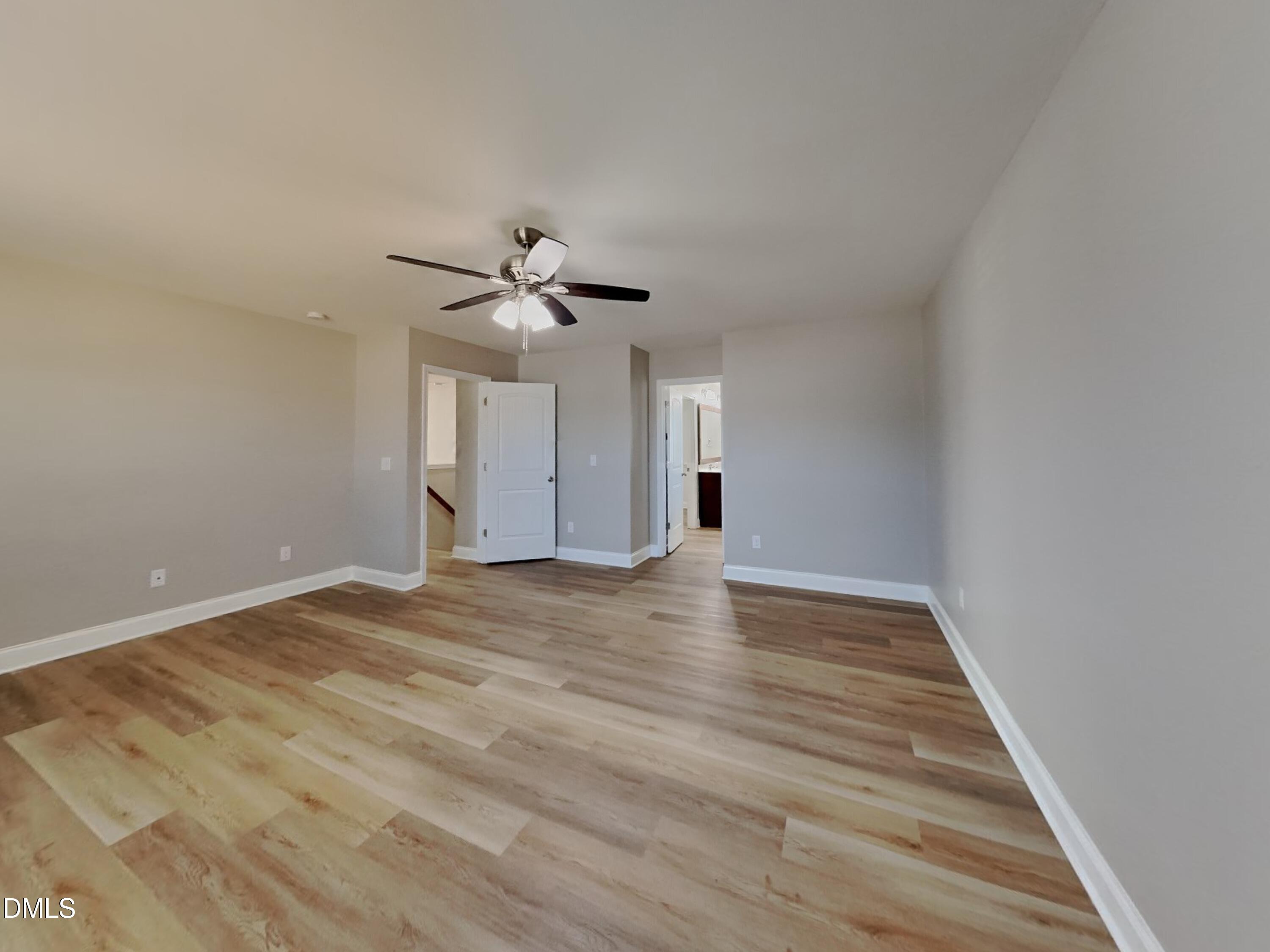 50 Gallery Park Drive Franklinton, NC 27525 - Photo 7 of 18 a view of an empty room with a chandelier fan