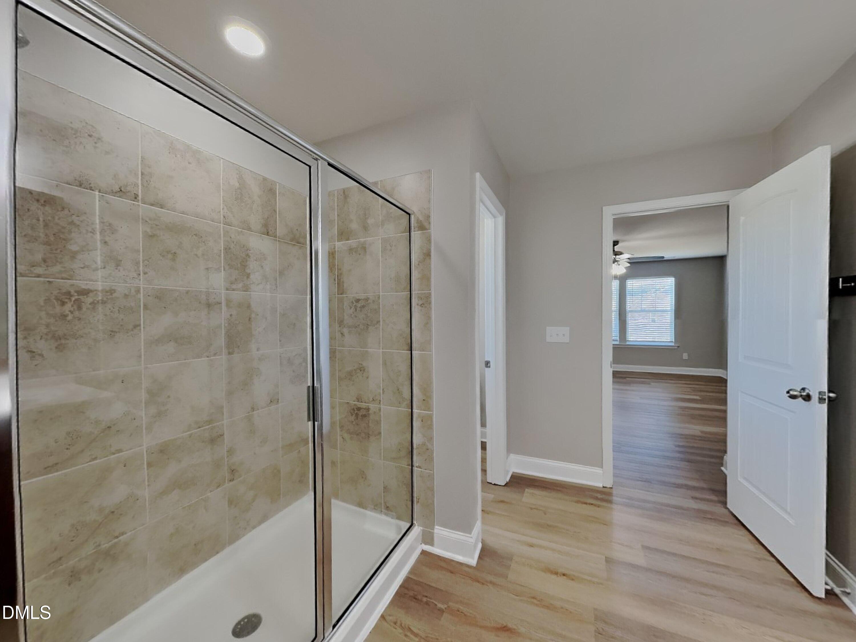 50 Gallery Park Drive Franklinton, NC 27525 - Photo 8 of 18 a bathroom with a glass shower door